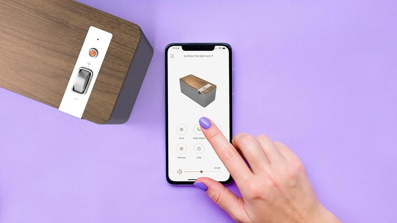 A person using the Klipsch Connect app to control the Klipsch The One Plus speaker.