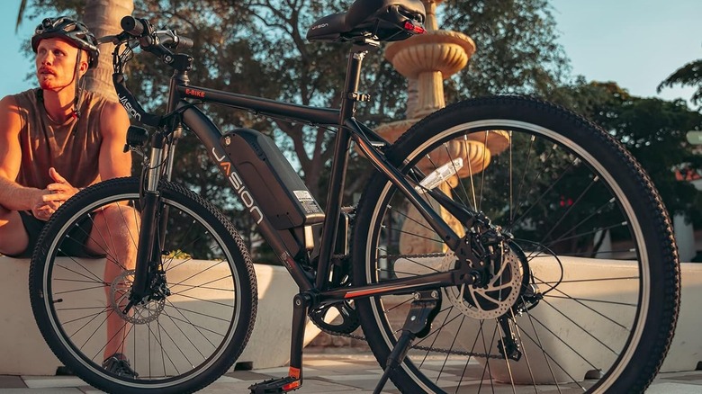 Jasion EB5 Electric Bike parked outside next to rider