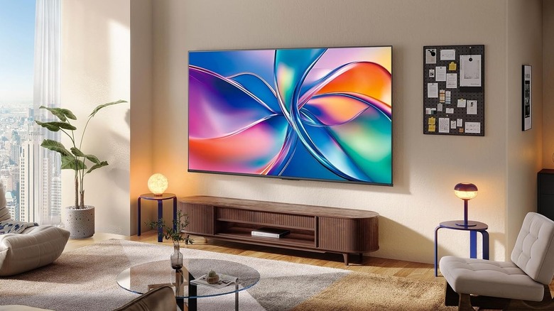 Hisense QD6QF TV mounted to a wall in a living room