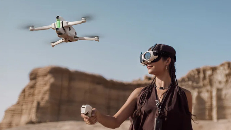 A woman piloting the Antigravity A1 drone