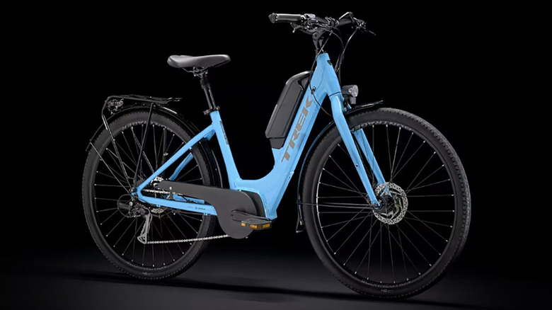 The Trek Verve+ 2 lowstep e-bike on a black background.