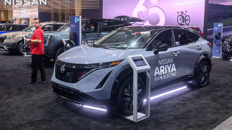 A 2025 Nissan Ariya on display at a convention