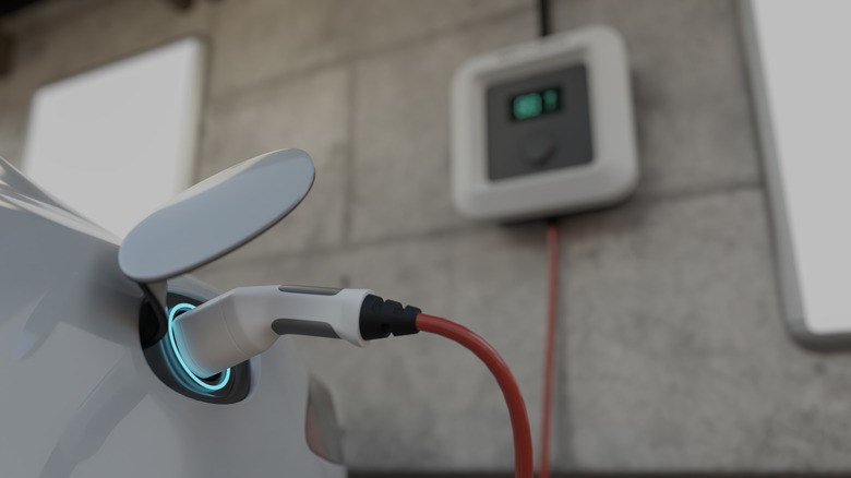 Electric vehicle being charged