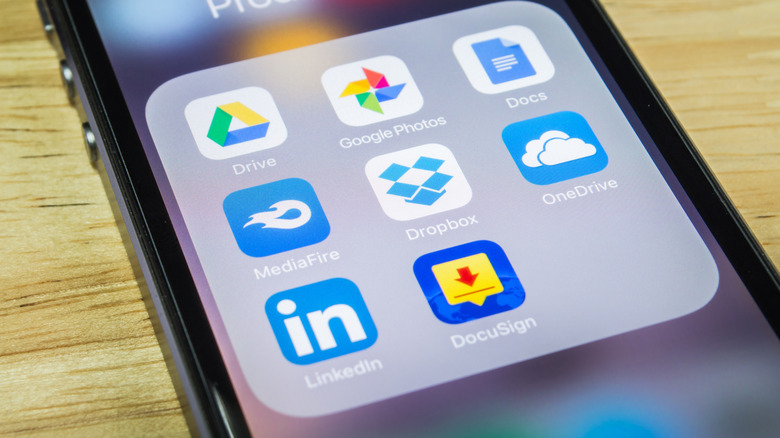 MediaFire app icon highlighted in a folder of cloud storage and productivity apps on a smartphone screen.