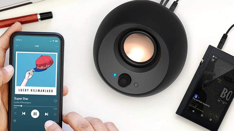 A Creative Pebble V3 speaker playing music.