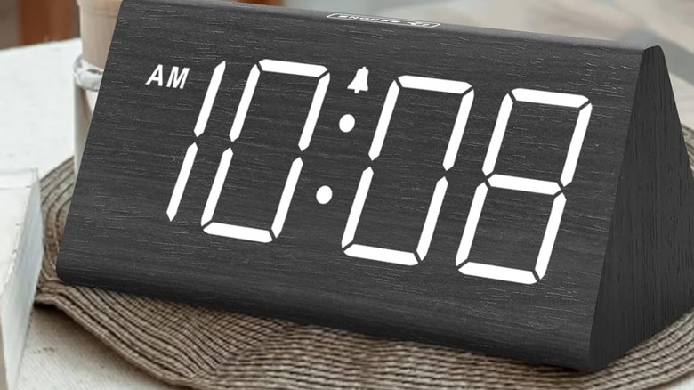 A DreamSky Wooden Digital Alarm Clock on a table.