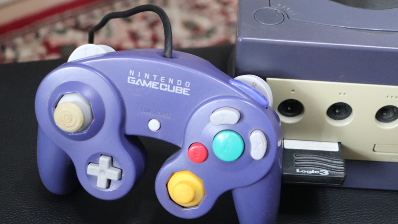 Nintendo Gamecube controller in front of a GameCube