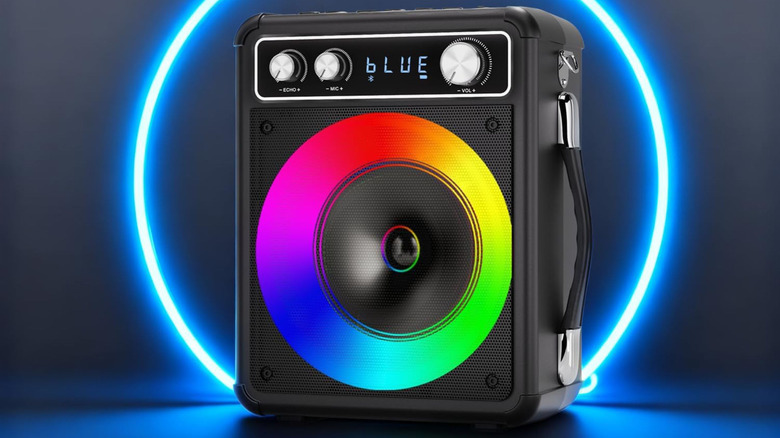 The Vosoco T-03 karaoke machine against a black background with a blue ring of light