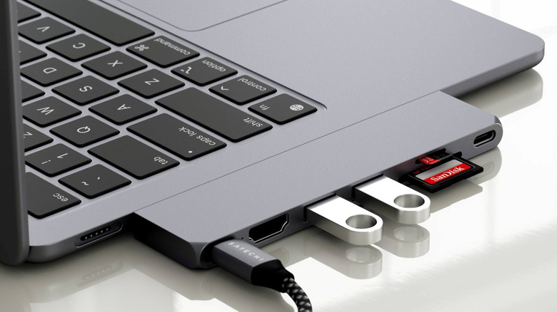 A Satechi Slim Pro Hub connected to MacBook Air resting on a desk