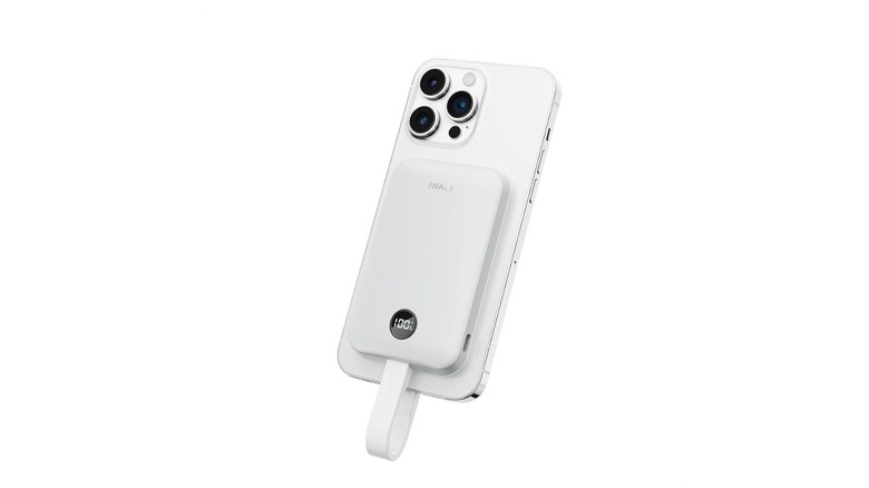 A white iWalk power bank attached to an iPhone. It's quite small and has a strap coming out from the bottom that functions as a cable
