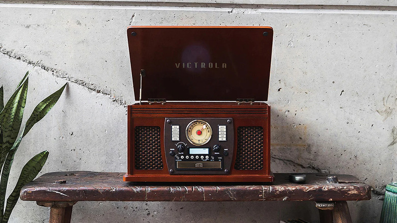 A large wooden record player on a table