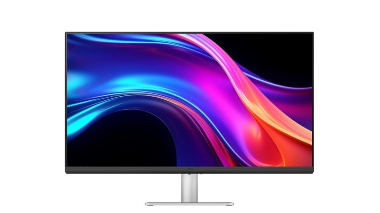 BenQ MA270UP monitor showing a colorful abstract wallpaper on a silver stand.
