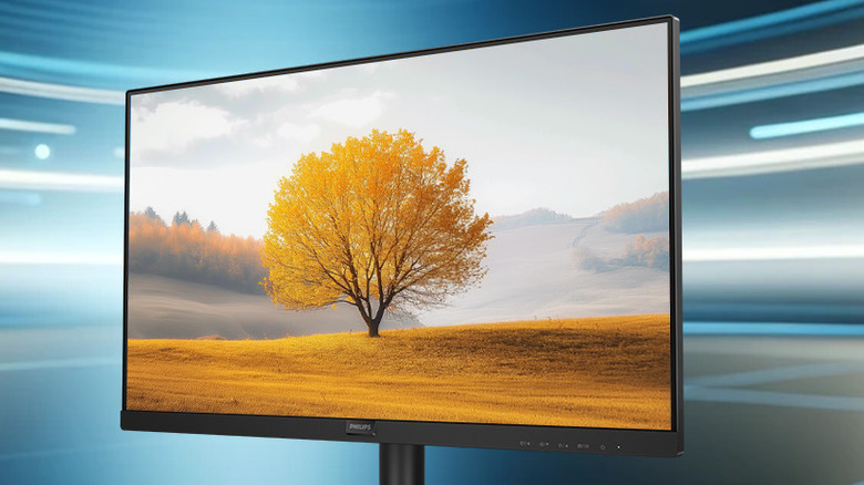 Philips 22-inch 221V8LB monitor displaying a tree on a dry grass field