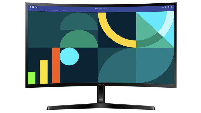 Samsung Essential S36GD curved monitor showing abstract shapes on screen.