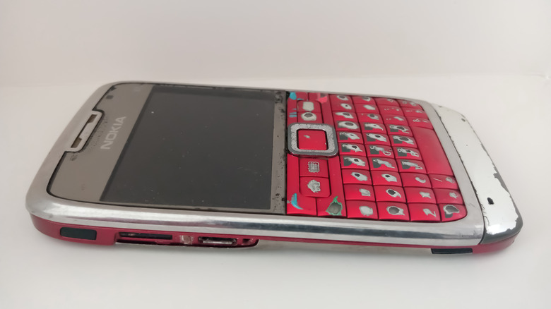 Nokia E71 with a red QWERTY keyboard shown on a white background.