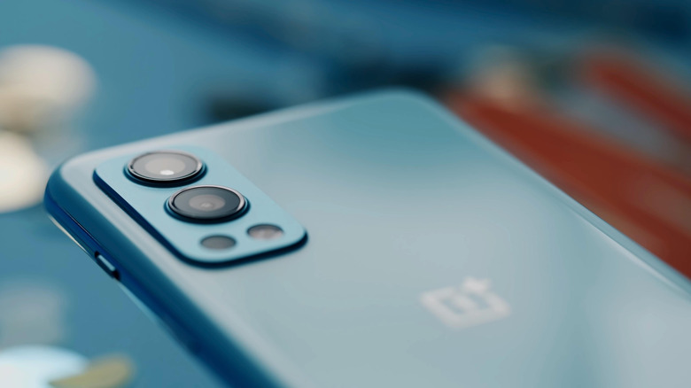 OnePlus phone in blue on blue background
