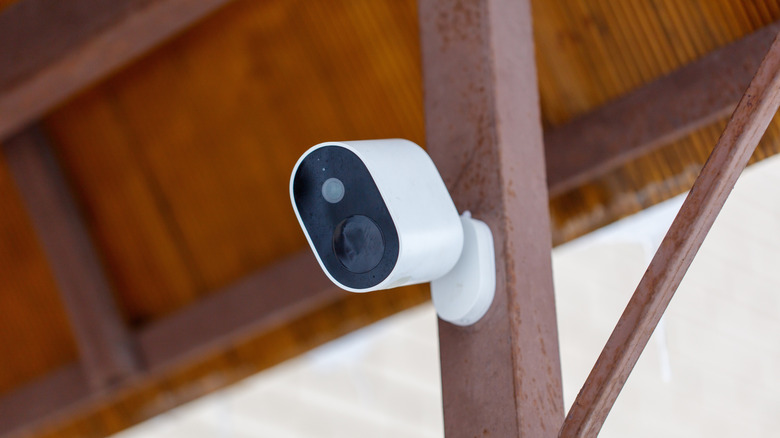 A security camera mounted on a metal pole