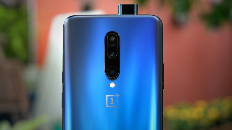The OnePlus 7 Pro in blue with its pop-up selfie camera extended.