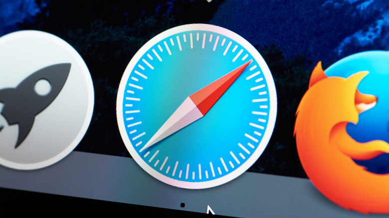 A closeup of the Safari icon sitting in the dock within macOS, the icon is next to the launcher icon and Mozilla Firefox
