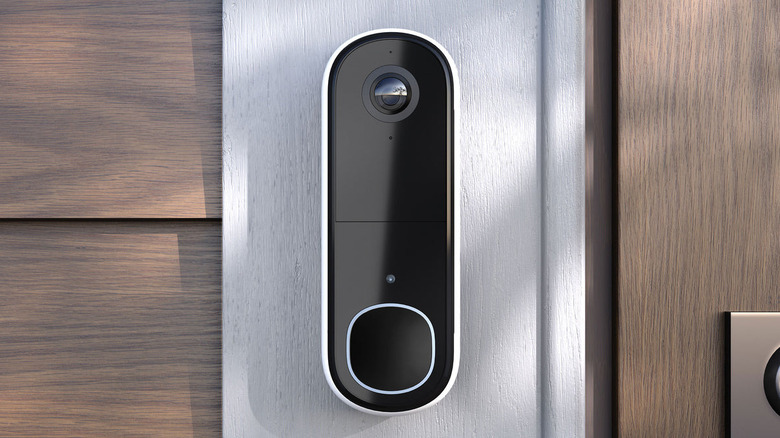 Close-up of the Arlo Video Doorbell 2K (2nd Gen) on a wooden door