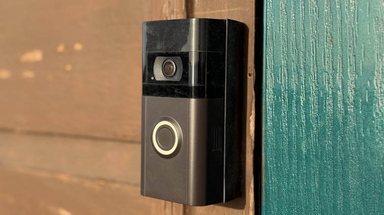 Close-up of a video doorbell mounted on the facade of a home