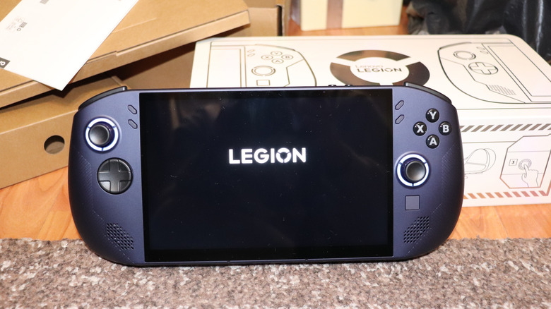 Lenovo Legion Go S handheld gaming PC with its box in the background.