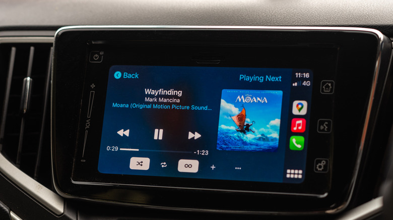 Apple CarPlay dashboard display showing music playing