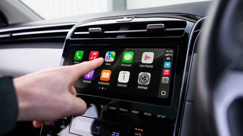 Driver using Apple Carplay