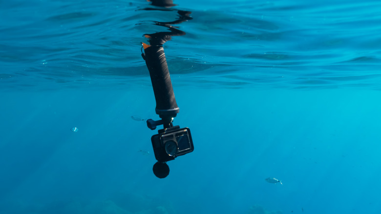 An action camera submerged underwater