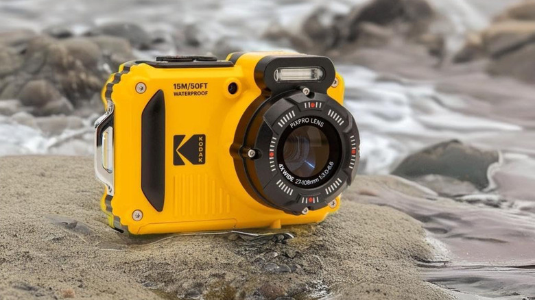 A Kodak PixPro WPZ2 underwater camera positioned on the shore