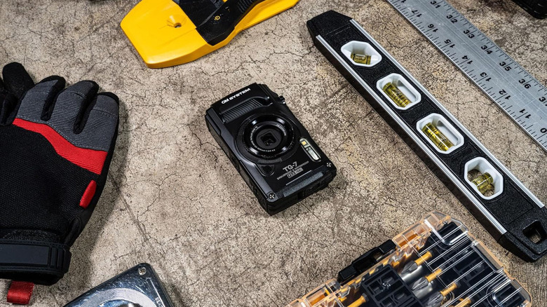 OM System Olympus Tough TG-7 underwater camera on a workbench