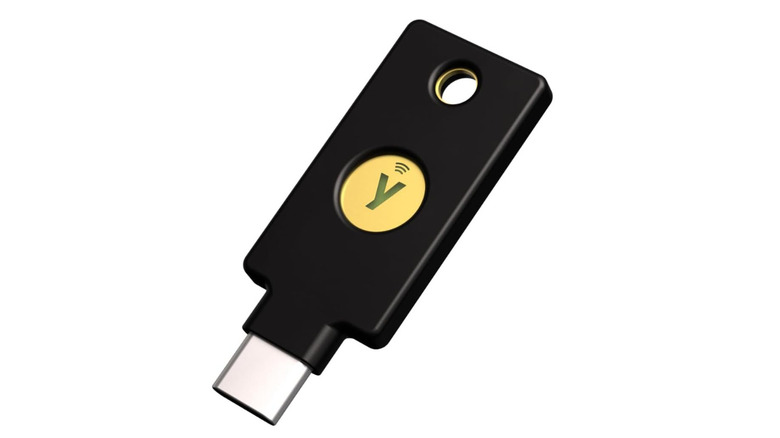 A USB security key on white background