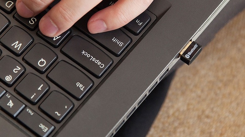 A TP-Link USB Bluetooth adapter connected to a laptop