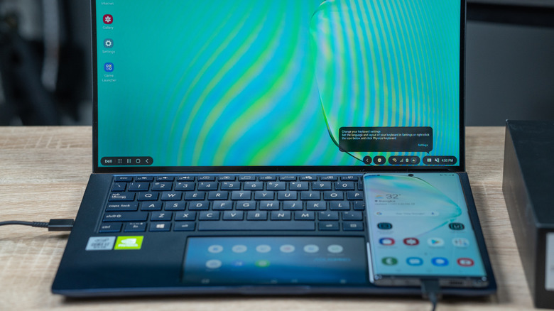 A Samsung phone connected to a laptop