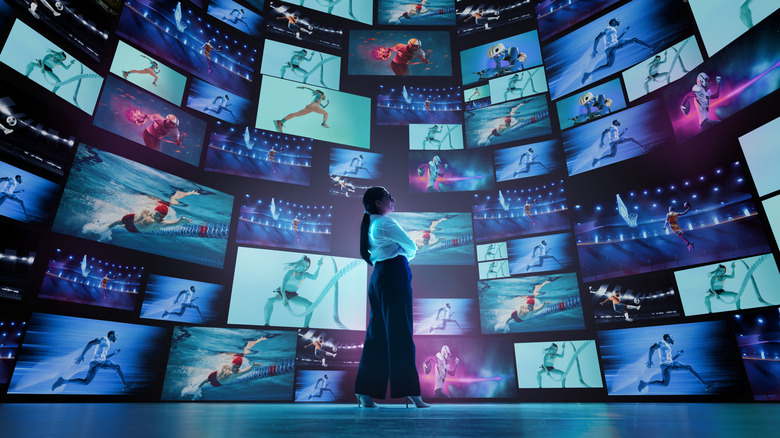 person looking at different type of screens