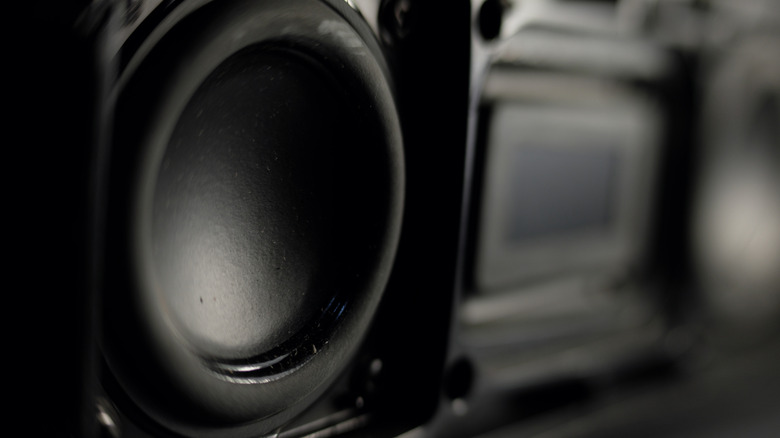 Close-up of speaker driver cone in home theater audio system