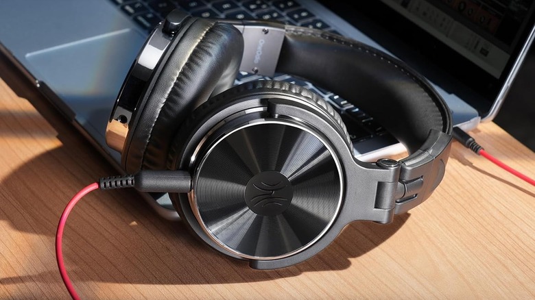 OneOdio Pro 10 resting on a laptop keyboard.