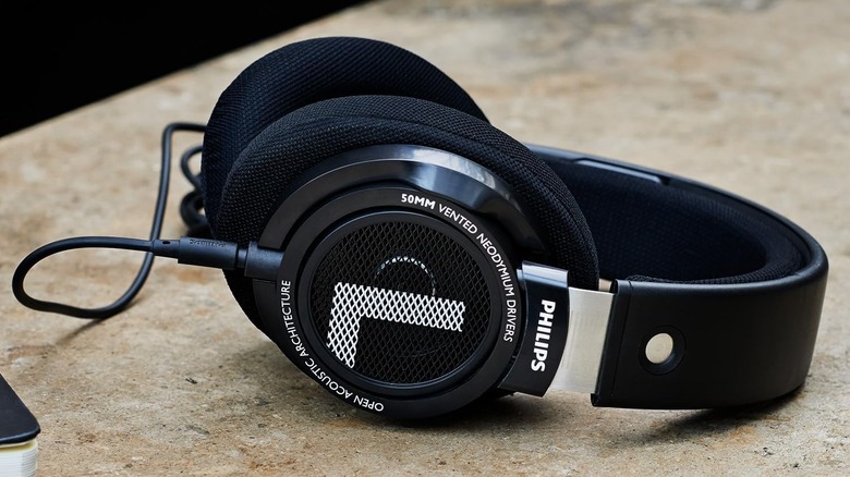 Philips SHP9500 kept on a beige-colored flat surface.