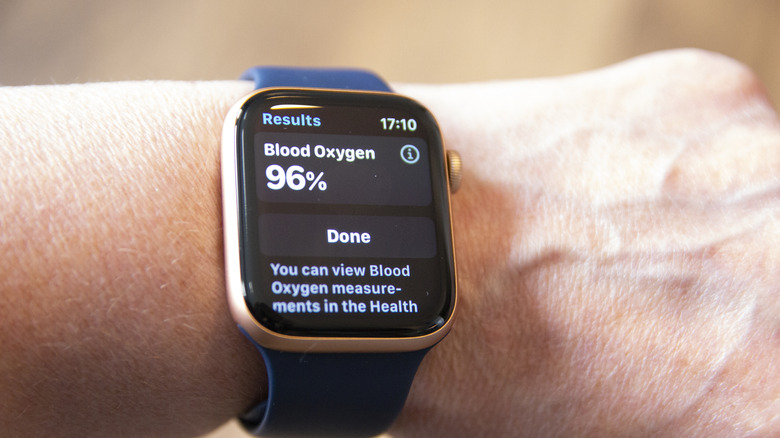 An Apple Watch user performing a blood oxygen reading.
