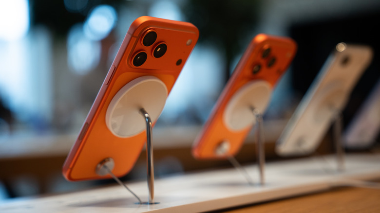 The iPhone 17 series on display in a store, with the iPhone 17 Pro Max rear camera system in focus.