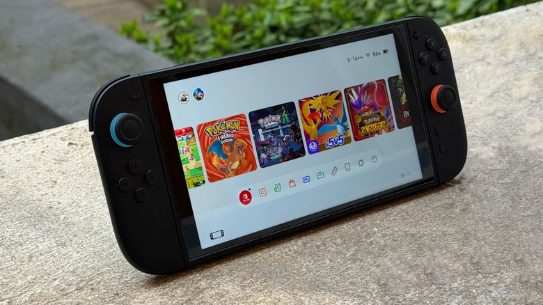 Nintendo Switch 2 in stand mode with a few Pokémon games on the console's Home Screen