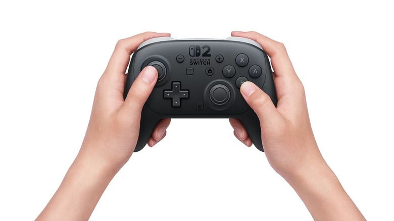 A hand holding the Nintendo Switch 2 Pro Controller