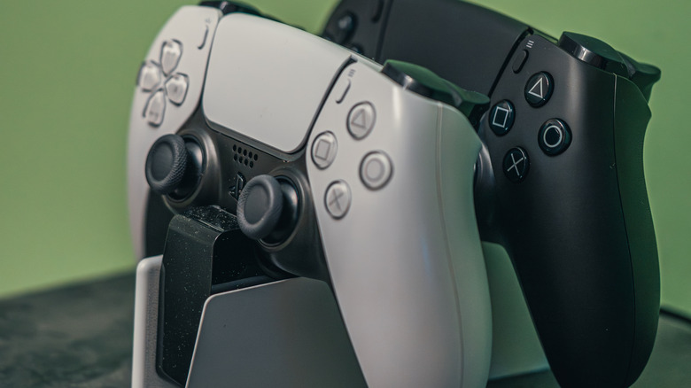 Two controllers plugged in to the DualSense Charging Station.