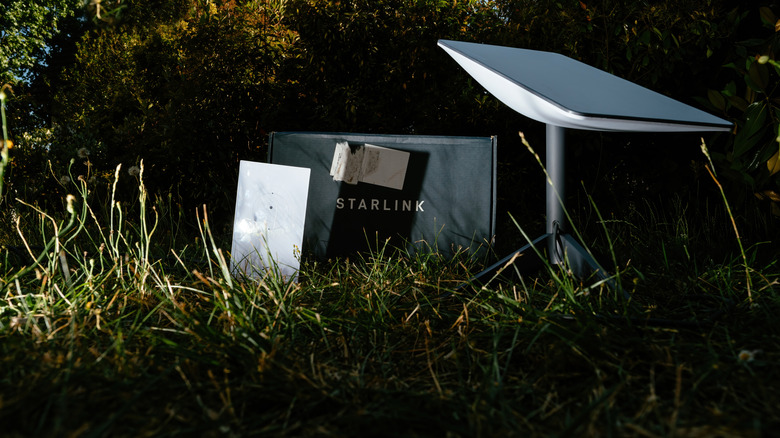 Unboxing Starlink in a field