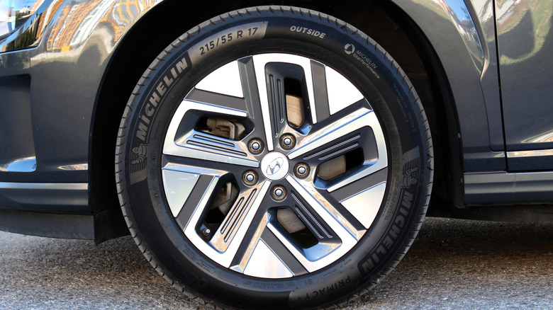 Close-up of aerodynamic EV wheel with Michelin tire mounted on electric vehicle