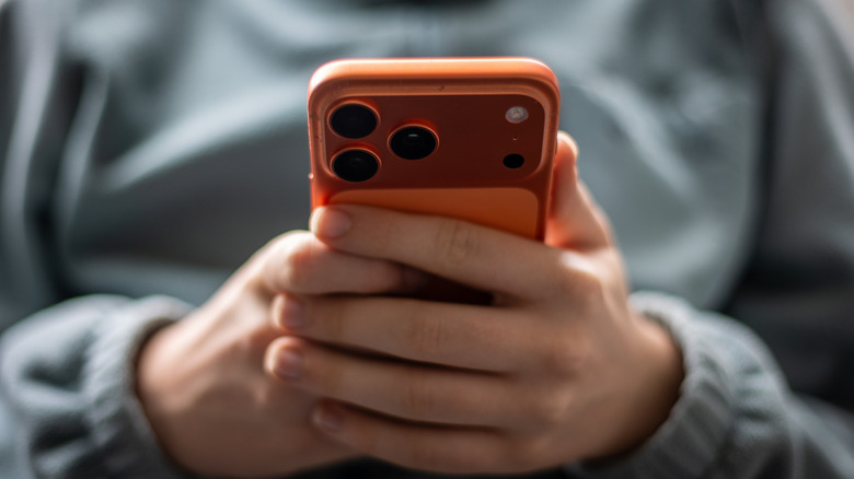 A person looks at an iPhone screen