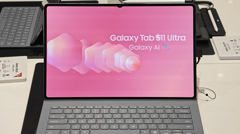 Samsung Galaxy Tab S11 Ultra attached to a keyboard case with a pink Galaxy AI screen.