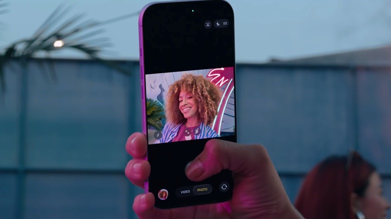 Taking a selfie with the iPhone 17's Center Stage selfie camera.