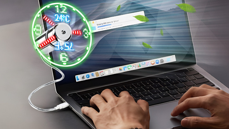 Breis USB Clock Fan plugged into a laptop displaying the time and temperature.