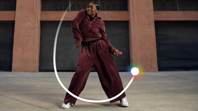 Google Circle to Search highlighted around a person dancing on a smartphone screen.